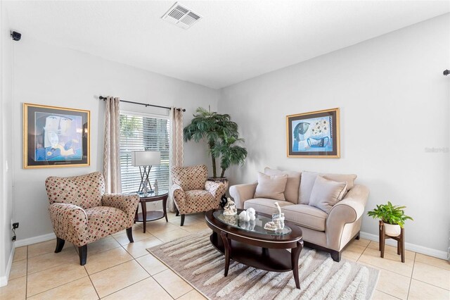 1785 Rushden Dr, Ocoee, FL 34761 - living room featuring light tile patterned floors and baseboards