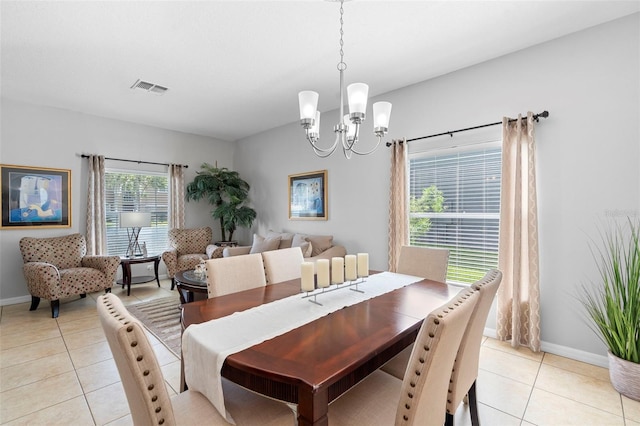 1785 Rushden Dr, Ocoee, FL 34761 - dining area with light tile patterned floors and a chandelier