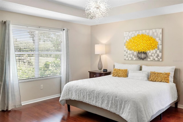 1785 Rushden Dr, Ocoee, FL 34761 - bedroom featuring wood finished floors, multiple windows, and a chandelier