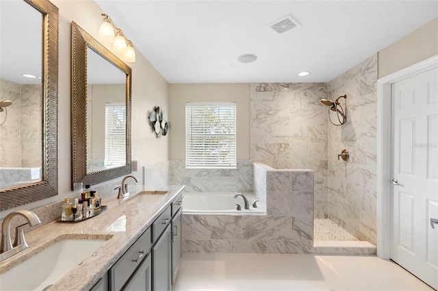 1785 Rushden Dr, Ocoee, FL 34761 - bathroom with a bath, double vanity, a walk in shower, and recessed lighting
