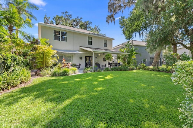 1785 Rushden Dr, Ocoee, FL 34761 - back of house featuring stucco siding and a patio