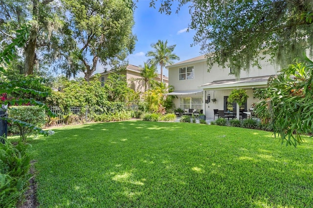 1785 Rushden Dr, Ocoee, FL 34761 - view of grassy yard featuring a patio area