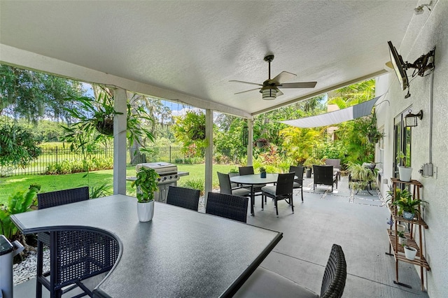 1785 Rushden Dr, Ocoee, FL 34761 - fenced backyard featuring outdoor dining space, a grill, a ceiling fan, and a patio