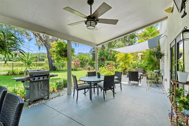 1785 Rushden Dr, Ocoee, FL 34761 - fenced backyard featuring outdoor dining space, area for grilling, a patio area, and a ceiling fan