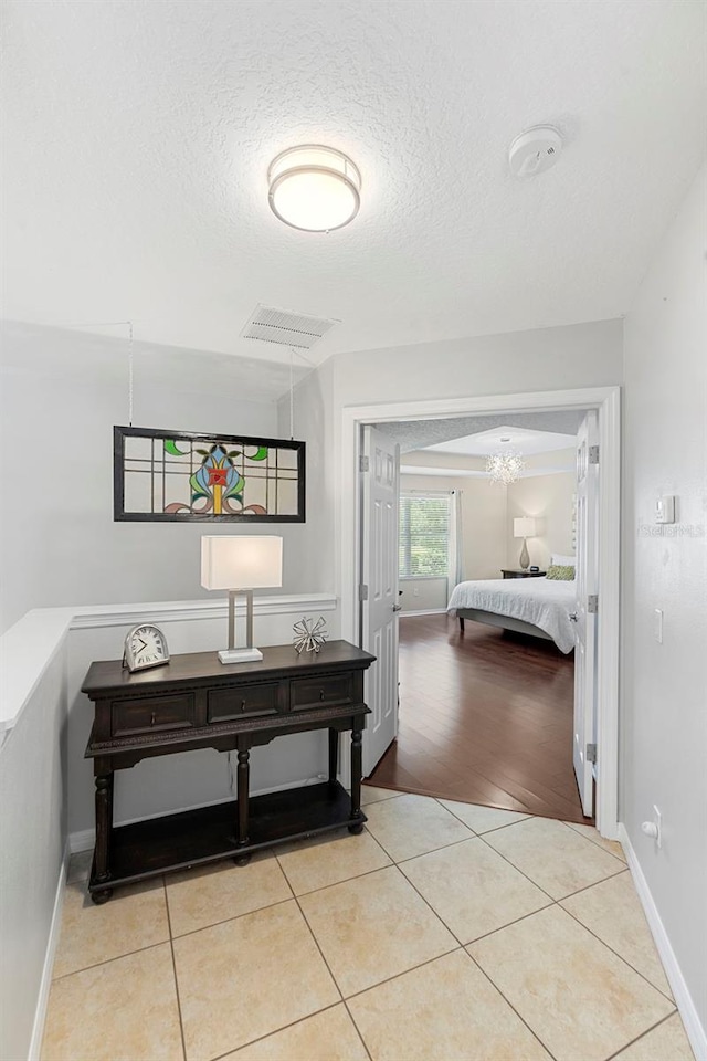 1785 Rushden Dr, Ocoee, FL 34761 - corridor with light tile patterned flooring and a textured ceiling