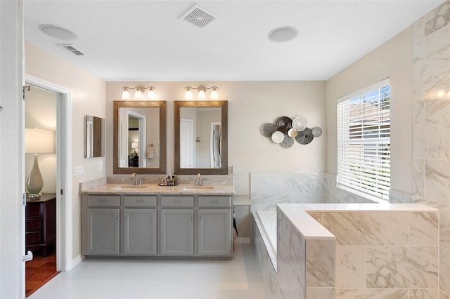 1785 Rushden Dr, Ocoee, FL 34761 - bathroom with double vanity and a bath