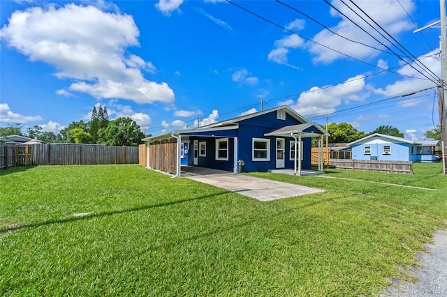 205 9th St, Saint Cloud, FL 34769 - back of property featuring a fenced backyard and a patio area