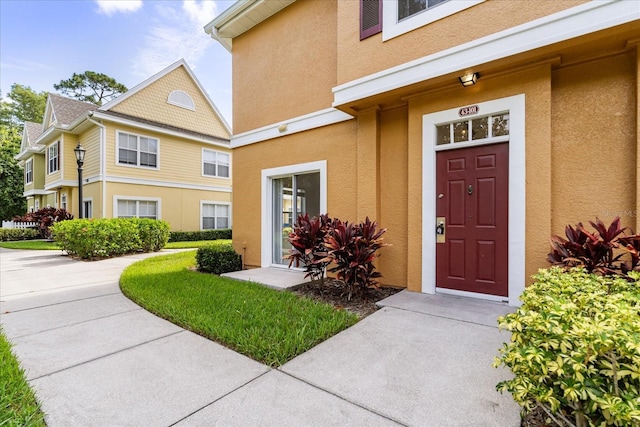 2280 San Vital Dr Unit 101, Kissimmee, FL 34741 - doorway to property featuring stucco siding