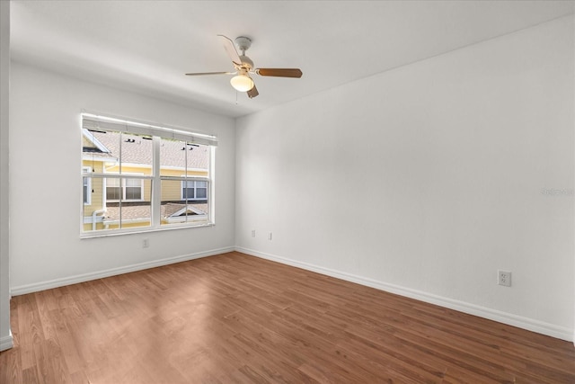 2280 San Vital Dr Unit 101, Kissimmee, FL 34741 - empty room featuring a ceiling fan and wood finished floors