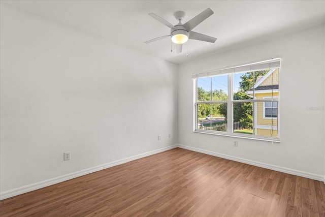 2280 San Vital Dr Unit 101, Kissimmee, FL 34741 - unfurnished room featuring wood finished floors and a ceiling fan