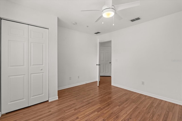 2280 San Vital Dr Unit 101, Kissimmee, FL 34741 - unfurnished bedroom with light wood-style flooring, a closet, and ceiling fan