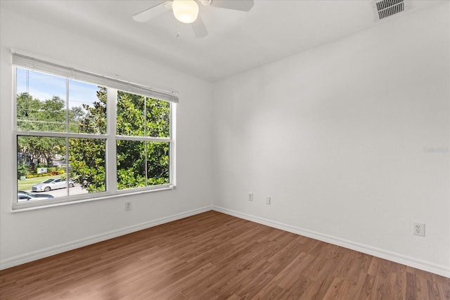 2280 San Vital Dr Unit 101, Kissimmee, FL 34741 - empty room with ceiling fan and wood finished floors