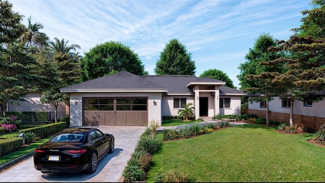 16459 Hillsborough Blvd, Port Charlotte, FL 33954 - prairie-style house featuring decorative driveway, a garage, and stucco siding