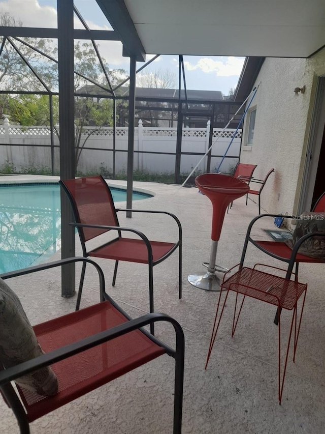 3013 Barrymore Ct, Orlando, FL 32835 - sunroom / solarium with a pool and beamed ceiling