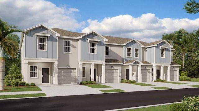 5969 Zen Way, Clermont, FL 34714 - view of front of home with an attached garage, driveway, and board and batten siding