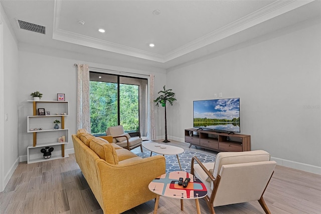 1388 Lombardi Ct, Kissimmee, FL 34759 - living area with ornamental molding, wood finished floors, a raised ceiling, and recessed lighting