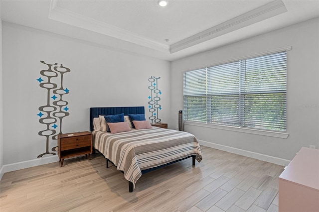 1388 Lombardi Ct, Kissimmee, FL 34759 - bedroom with a raised ceiling, ornamental molding, and light wood-type flooring