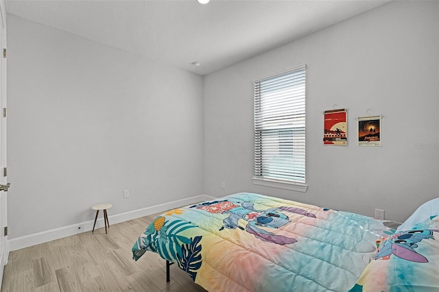 1388 Lombardi Ct, Kissimmee, FL 34759 - bedroom featuring wood finished floors and baseboards