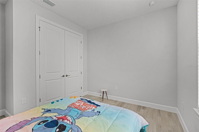 1388 Lombardi Ct, Kissimmee, FL 34759 - bedroom featuring light wood-style floors and a closet