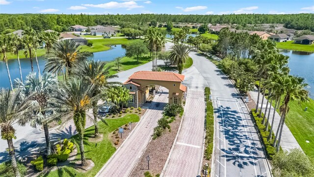 1388 Lombardi Ct, Kissimmee, FL 34759 - aerial perspective of suburban area with a large body of water and a heavily wooded area
