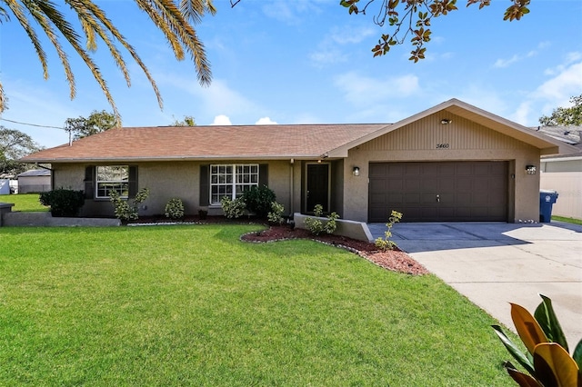 3460 Tomahawk Ave, Spring Hill, FL 34606 - ranch-style home featuring driveway, a garage, stucco siding, and a front yard