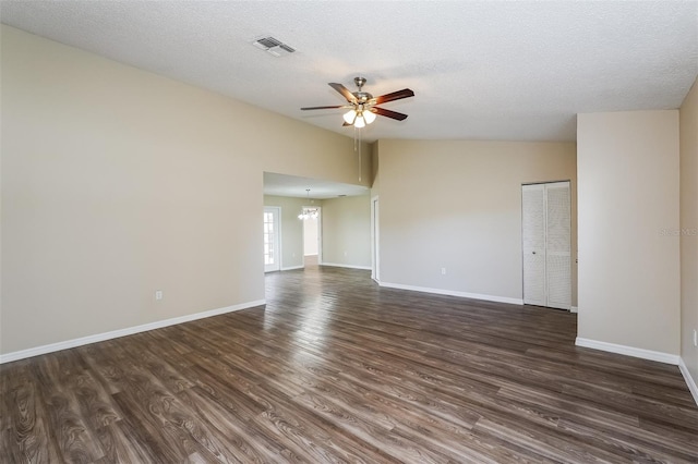 3460 Tomahawk Ave, Spring Hill, FL 34606 - unfurnished room with ceiling fan, dark wood-type flooring, a textured ceiling, and a chandelier