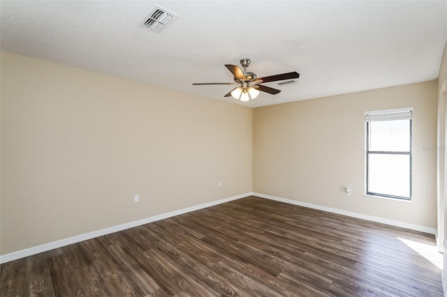3460 Tomahawk Ave, Spring Hill, FL 34606 - unfurnished room featuring ceiling fan, dark wood-type flooring, and a textured ceiling