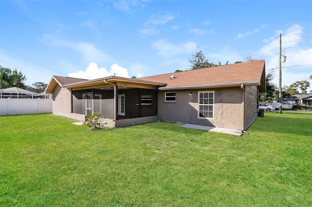 3460 Tomahawk Ave, Spring Hill, FL 34606 - back of house with a sunroom and stucco siding