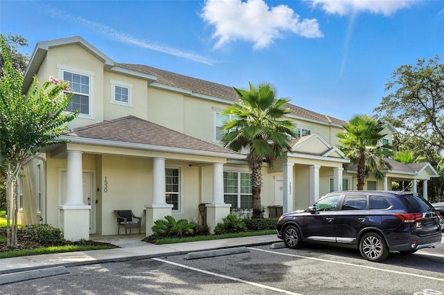 1530 Retreat Cir, Clermont, FL 34714 - view of front of house with stucco siding, uncovered parking, and roof with shingles