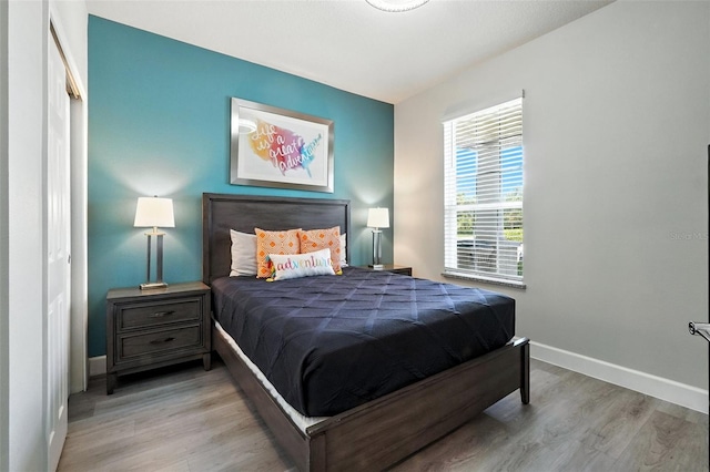 1530 Retreat Cir, Clermont, FL 34714 - bedroom with baseboards and wood finished floors