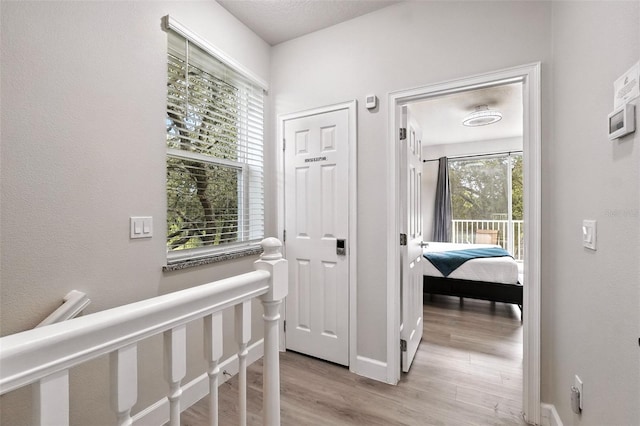 1530 Retreat Cir, Clermont, FL 34714 - hall featuring light wood-style flooring and baseboards