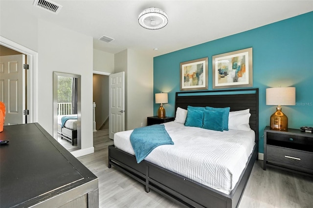 1530 Retreat Cir, Clermont, FL 34714 - bedroom featuring light wood-type flooring