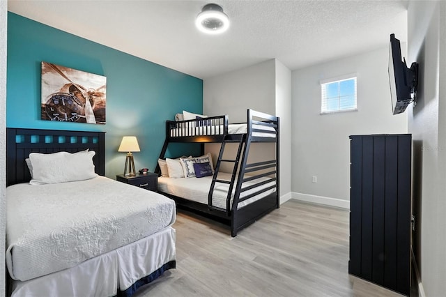 1530 Retreat Cir, Clermont, FL 34714 - bedroom with light wood-style floors and baseboards