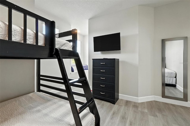 1530 Retreat Cir, Clermont, FL 34714 - bedroom featuring wood finished floors and a textured ceiling
