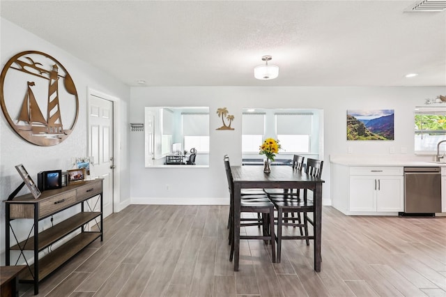 2926 Carriage Dr, South Daytona, FL 32119 - dining space with light wood-style floors, recessed lighting, and a textured ceiling