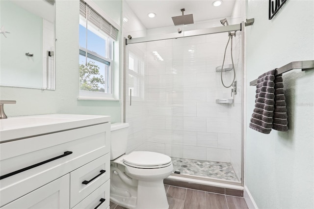 2926 Carriage Dr, South Daytona, FL 32119 - bathroom featuring vanity, a shower stall, wood finished floors, and recessed lighting