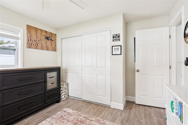 2926 Carriage Dr, South Daytona, FL 32119 - unfurnished bedroom with wood finish floors, a closet, and ceiling fan