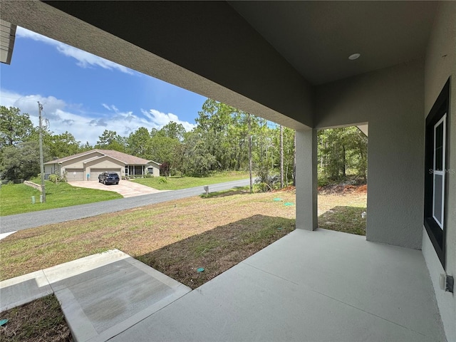 7687 N Quibble Ave, Dunnellon, FL 34434 - view of patio / terrace featuring view of wooded area
