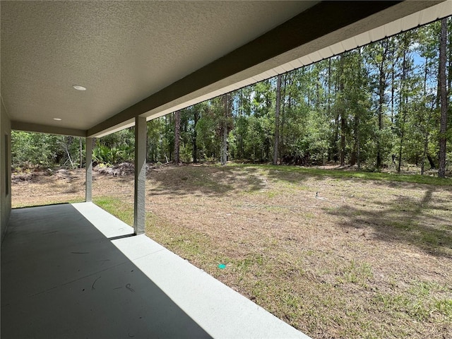 7687 N Quibble Ave, Dunnellon, FL 34434 - view of green lawn featuring a patio