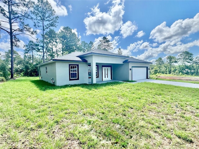 8051 N Pinkinz Way, Citrus Springs, FL 34433 - view of front of home featuring stucco siding, driveway, an attached garage, and a front yard