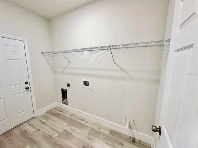 8051 N Pinkinz Way, Citrus Springs, FL 34433 - laundry area featuring light wood-style floors, electric dryer hookup, and washer hookup