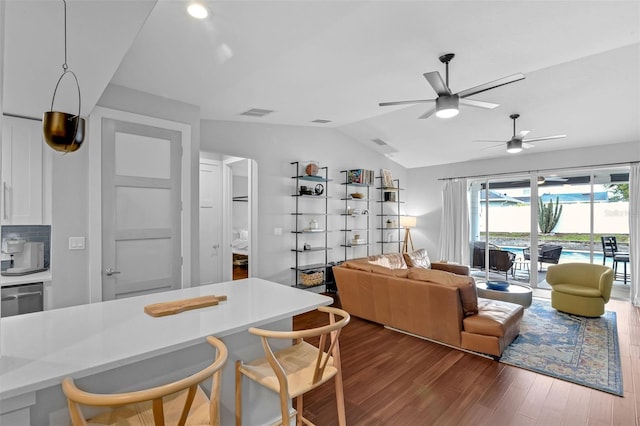 1322 N Bumby Ave, Orlando, FL 32803 - living area featuring dark wood-style floors, vaulted ceiling, and ceiling fan