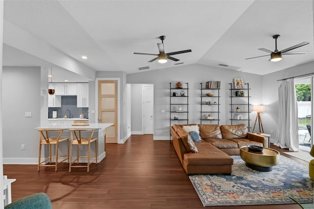 1322 N Bumby Ave, Orlando, FL 32803 - living room with ceiling fan, vaulted ceiling, and dark wood-style flooring