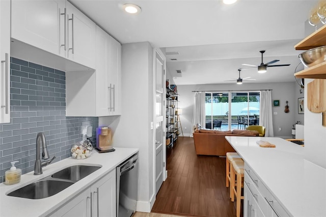 1322 N Bumby Ave, Orlando, FL 32803 - kitchen with dishwasher, ceiling fan, light countertops, white cabinets, and dark wood-style floors