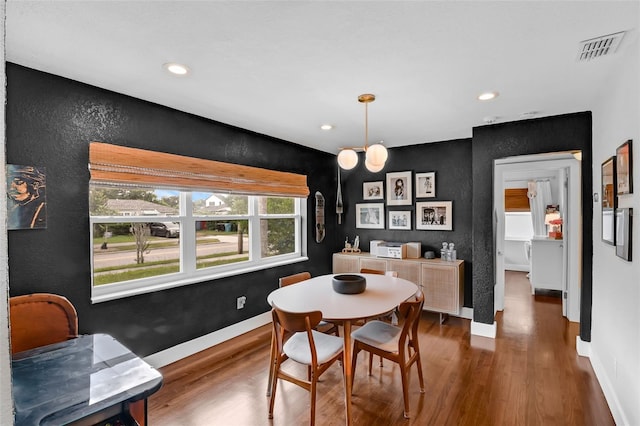 1322 N Bumby Ave, Orlando, FL 32803 - dining area featuring wood finished floors, recessed lighting, and a textured wall