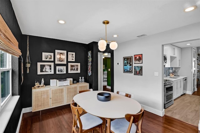 1322 N Bumby Ave, Orlando, FL 32803 - dining space featuring wood finished floors and recessed lighting