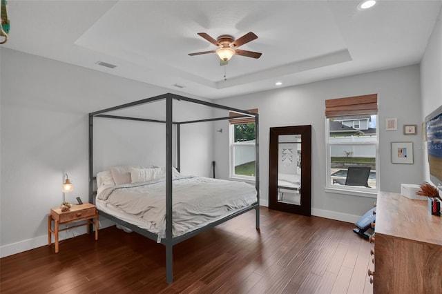 1322 N Bumby Ave, Orlando, FL 32803 - bedroom with a tray ceiling, recessed lighting, wood finished floors, and a ceiling fan