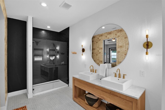 1322 N Bumby Ave, Orlando, FL 32803 - bathroom with tiled shower, double vanity, and recessed lighting
