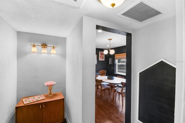 1322 N Bumby Ave, Orlando, FL 32803 - corridor featuring wood finished floors and a textured wall