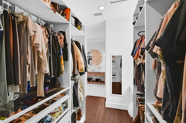1322 N Bumby Ave, Orlando, FL 32803 - walk in closet featuring wood finished floors